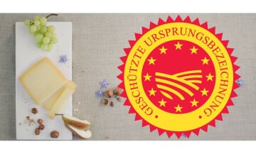 links im Bild ein Schneidebrett mit Käse, Trauben, Nüssen und Birnenscheiben, rechts gU Logo
