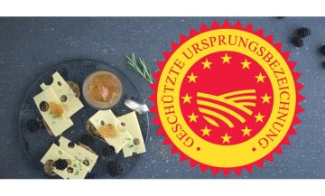 links im Bild ein Teller mit Emmentaler Käsebroten dekoriert, rechts gU Logo